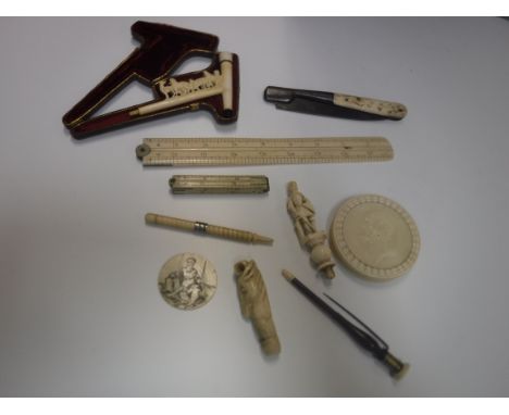 A collection of 19th Century ivory, bone and meerschaum items to include a cased meerschaum pipe bowl decorated with dogs, a 