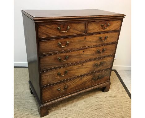 A 19th Century figured mahogany chest of two short over four long graduated drawers with brass swan neck handles, raised on b
