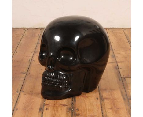 ARR Antonio Cagianelli (Italian, born 1964), Transvital, a black glazed ceramic model of a stylised skull, painted signature 