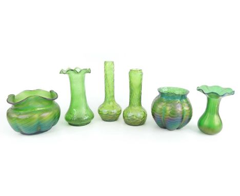 A collection of six Loetz style Art Nouveau green glass vases, early 20th century, of varying shapes and sizes, largest h.9cm