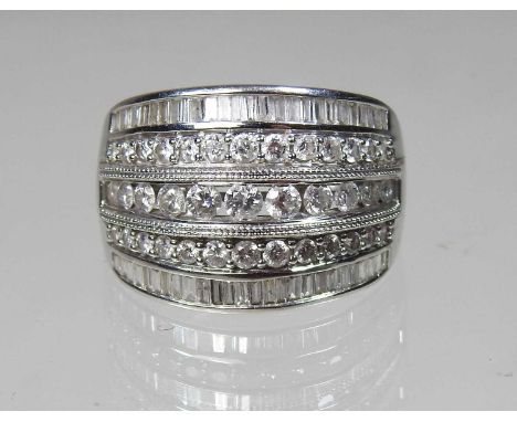 An 18 carat gold diamond dress ring, composed of five rows of graduated stones, approximately 1.50 carats, size Q