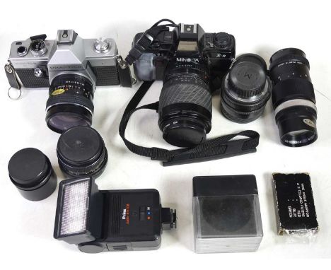 A large collection of cameras and lenses, to include a Minolta Rokkor-TC 135mm lens and a Pentacon Auto 1.8/50 multicoating l