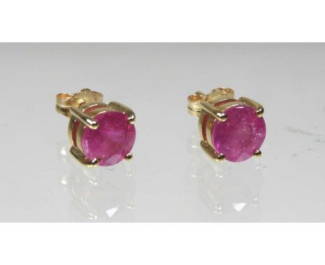 A pair of 10 carat gold ruby stud earrings, approximately two carats