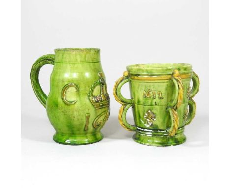 A Castle Hedingham pottery green glazed mug, relief decorated with a crown, inscribed CR and dated 1646, castle pad mark to b