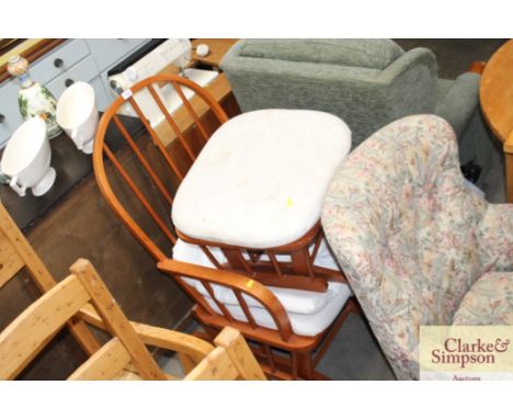 A Dutailier stick-back rocking chair with matching rocking footstool