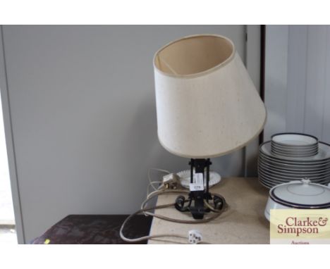 A wrought iron standard lamp and shade; together with one other