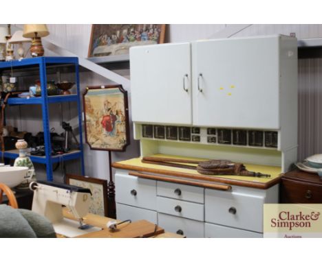 A kitchen dresser raised on cupboard base fitted six drawers with pull out enamel slide 
