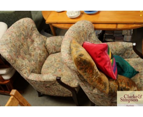 A pair of Parker Knowle button back tub shaped armchairs
