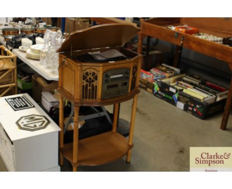 A vintage style record/ radio cassette and CD player