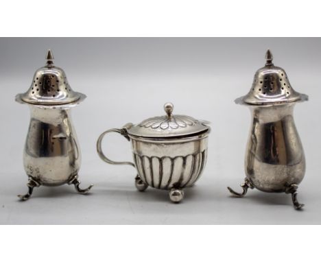 Three piece Sterling Silver Condiment Set  To include a Salt Shaker, a Pepper Shaker and a Mustard Pot The Salt Shaker and Pe