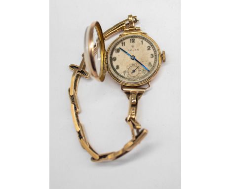 Vintage Ladies Rolex Watch with 9ct Gold Adjustable Watch Bracelet. The Watch face has "ROLEX" in black lettering.  The watch