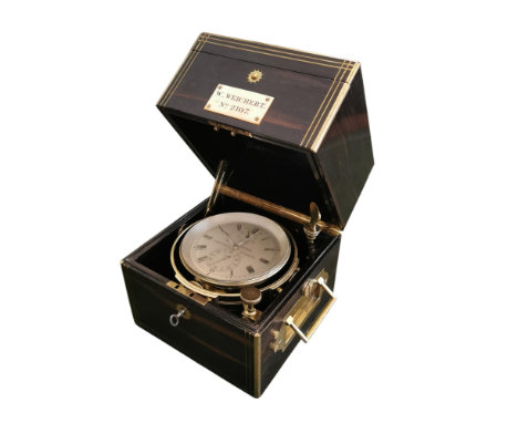 A 19th Century Marine Chronometer By Weichert In A Brass Bound 'Campaign' Style Coromandel Case.  The chronometer has a three