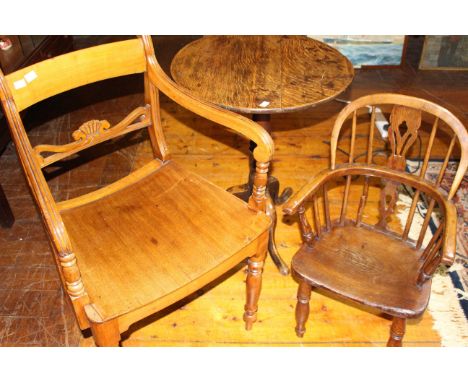 An early 19th century mahogany carver chair with downswept arms, dished seat, baluster turned tapering legs, a George iii oak