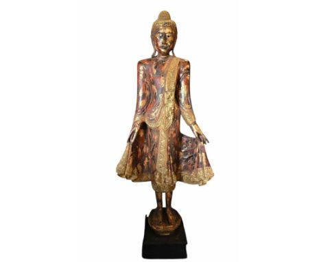 Standing Buddha an unusual life size gilt wood standing Mandalay Buddha is likely from Burma . It has clear Tai Yai influence