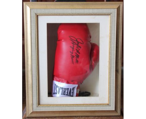 A signed " Jake LaMotta" Everlast boxing glove.Box framed and glazedCertificate to verso. 