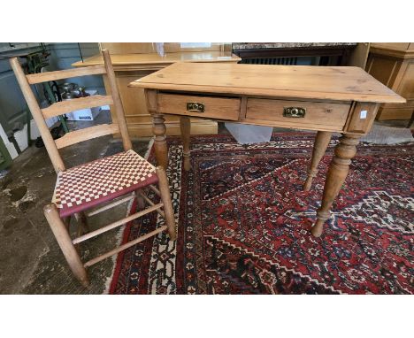 A Victorian pine school table and Shaker style ladder back chair with tape seatThe table fitted with two drawers with brass h