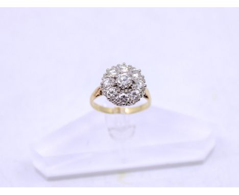 Vintage 18ct Gold Round Brilliant Cut Diamond Cluster Ring  The ring consists of an approx. 0.50ct Round Brilliant Cut Diamon