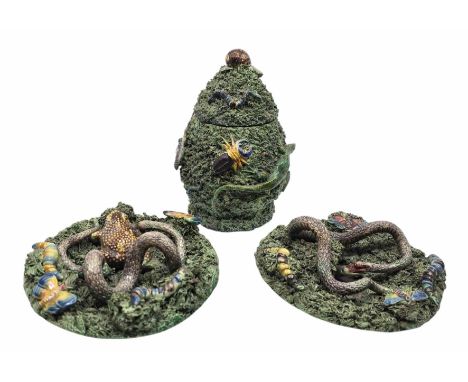 Three pieces of Portuguese Palissy Majolica pottery. To include two wall dishes one decorated with a snake attacking a lizard