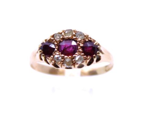 18ct Gold? Ruby and Rose Cut Diamond Ring The Ring consists of three Oval Brilliant Cut Rubies. The centre Ruby measures appr
