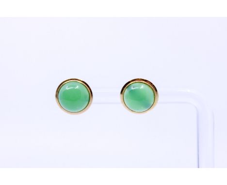 Pair of 14ct Gold Round Cabochon Jade Earrings  Each Earring consists of a Round Cabochon Jade that measures approx. 8.75mm. 
