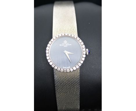 Ladies 18ct White Gold Baume & Mercier Geneve Swiss Made Watch Boxed The Watch has a Black dial and has "BAUME & MERCIER GENE