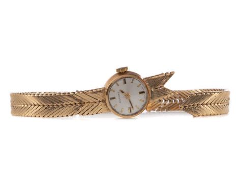 LADY'S ROTARY NINE CARAT GOLD MANUAL WIND WRIST WATCH,the round silvered dial with applied baton hour markers, 14mm case, on 