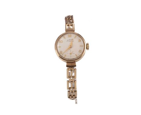 LADY'S UNO NINE CARAT GOLD MANUAL WIND WRIST WATCH,the round cream dial with applied baton and Arabic hour markers, subsidiar