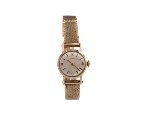 LADY'S TATTON NINE CARAT GOLD MANUAL WIND WRIST WATCH,the round silvered dial with applied baton and Arabic hour markers, 17m