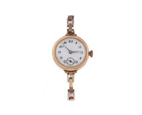 LADY'S NINE CARAT GOLD MANUAL WIND WRIST WATCH,the round white dial with Arabic hour markers, dot outer seconds track, subsid