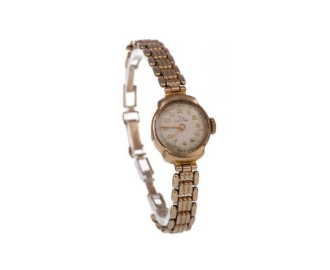 LADY'S RECORD NINE CARAT GOLD CASED MANUAL WIND WRIST WATCH,the round cream dial with applied Arabic hour markers, outer seco