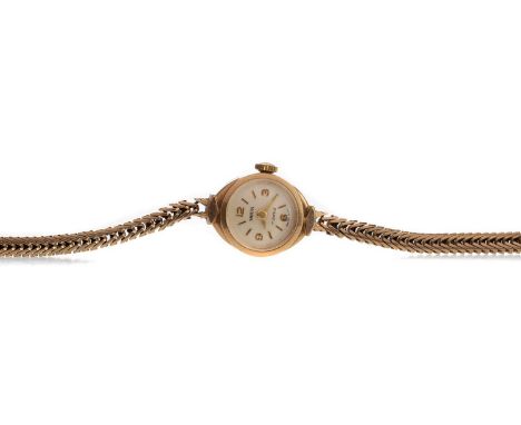LADY'S SMITHS NINE CARAT GOLD MANUAL WIND WRIST WATCH,the round cream dial with applied baton and Arabic hour markers, 14mm c