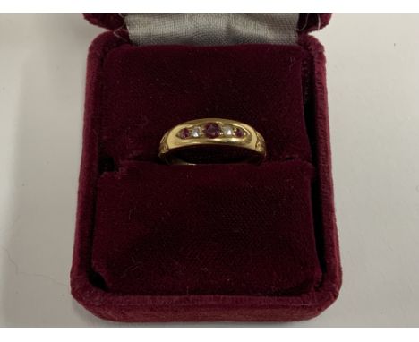An Edwardian 18K ruby and diamond ring. (A)