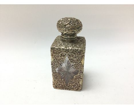 A silver perfume bottle, Birmingham hallmarks. Hinge lid with glass stopper.