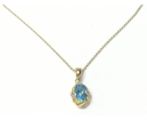 A gold plated silver pendant on a gold plated silver chain set with oval topaz and diamond. Postage A