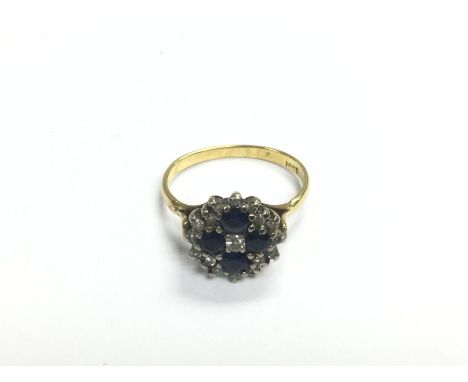 An 18ct gold ring set with sapphires and diamonds, approx 3.4g and approx size J-K. Shipping category A.