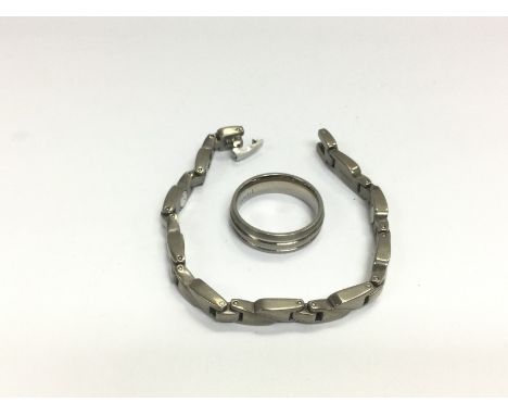 A titanium ring and bracelet (2). Shipping category A.