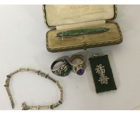 A Chinese jade pendent two silver rings set with Cabochons a silver bracelet and a vintage brooch in a fitted box (5) NO RESE