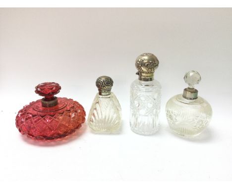 4 cut glass perfume bottles, two with silver stoppers