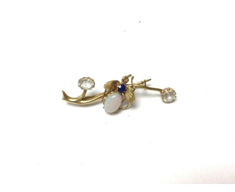 An Edwardian gold opal and sapphire set brooch.