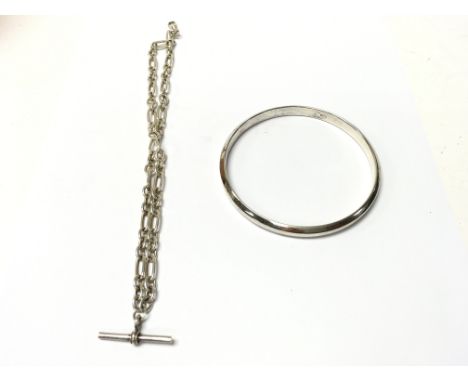A silver slave bangle circa 1921 and a T bar watch chain. Postage B