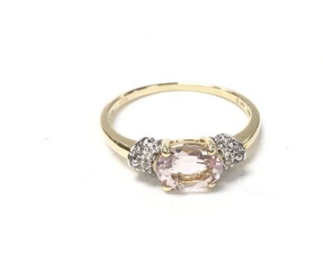 9ct yellow gold oval cut morganite ring with diamond shoulders. Boxed. Size P1/2 and 2.07g