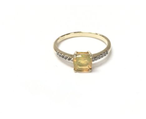 9ct yellow gold cushion cut yellow Opal and RC diamond dress ring. Size P 1/2 and 1.81g.Boxed.Postage B