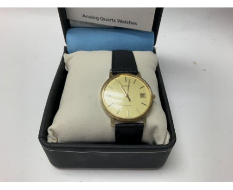 A tissot seastar date 9ct gold gents slimline press watch with papers and presentation watch.