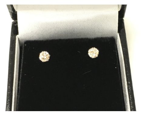 A pair of 18ct white gold 6 claw set solitaire diamond studs with silicon capped backs. Boxed. RBC diamonds 0.40ct Postage B