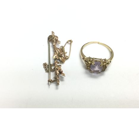 A 9ct gold stone set ring and a 9ct gold brooch, approx total weight 4.5g. Shipping category A.