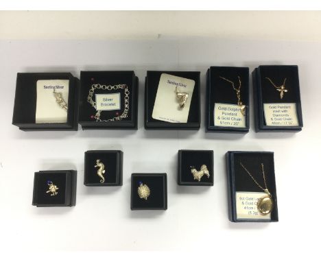 Three gold pendants and chains including a diamond set flower pendant, six silver charms and a silver bracelet. Shipping cate