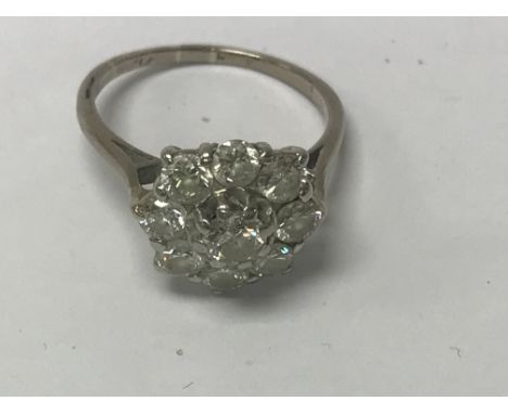 A Diamond cluster ring marked platinum.