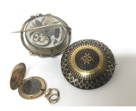 A late 19th gold cased Mourning locket with engine turned pattern a Quality pique gold and tortoiseshell brooch and one other