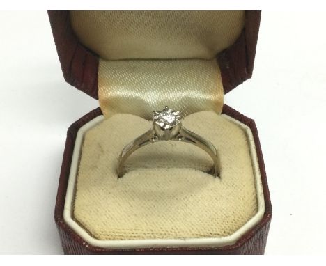 An 18ct gold solitaire diamond ring, approx 2.9g and approx size O. Shipping category A.