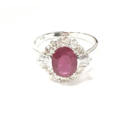 18ct white gold oval ruby and diamond cluster ring. Ruby 1.78ct Diamonds 0.88ct. With Gemologist report. Ring size N 1/2.